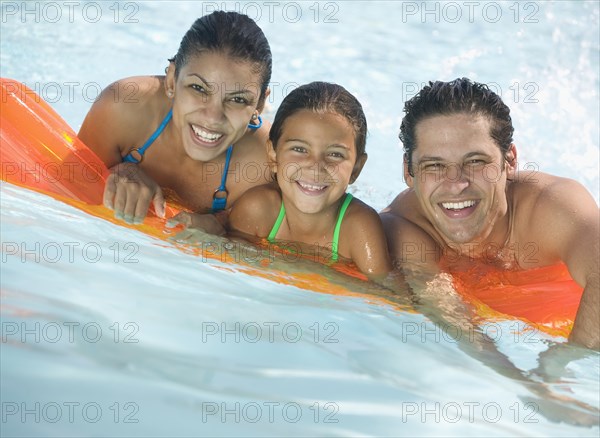 Portrait of family in swimming pool