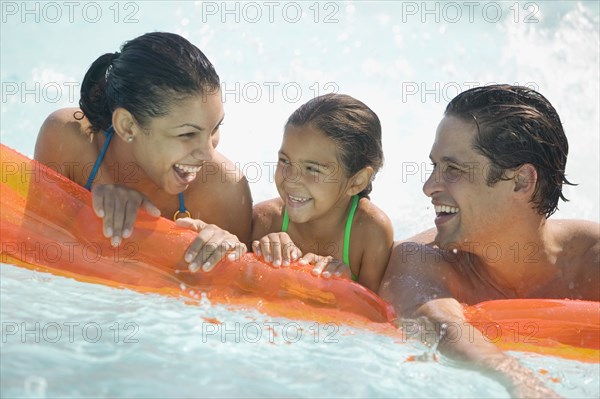 Family in swimming pool