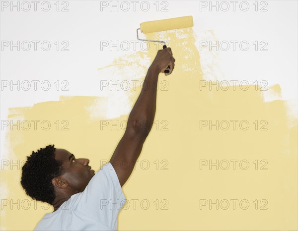 Man painting wall