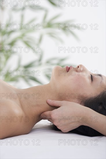 Woman receiving neck massage