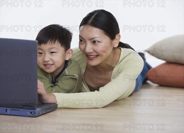 Mother and son with laptop