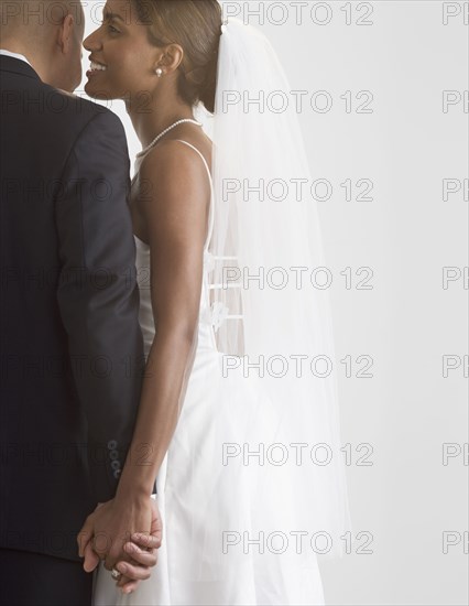 Bride and groom holding hands