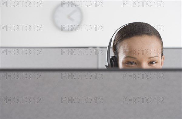 Upper section of woman's head in office