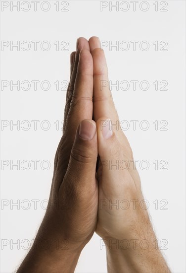 Close up of two hands in praying position