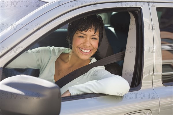 Portrait of woman sitting inside car