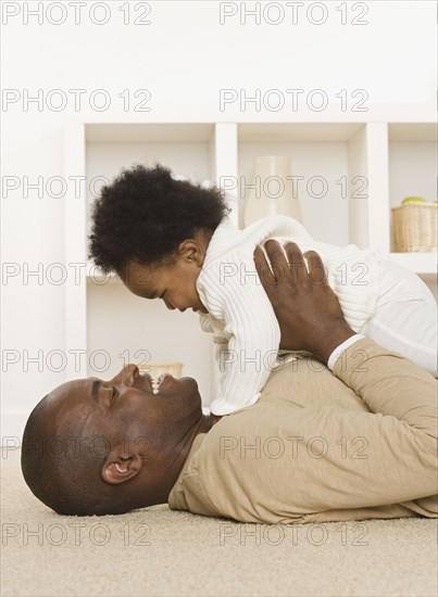 Father playing with his baby daughter