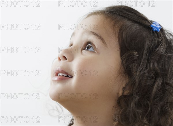 Little girl looking up