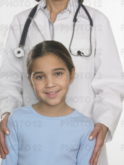 Young girl and female doctor posing for the camera