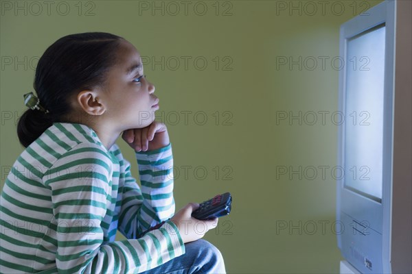 Young girl watching television