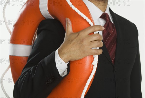 Close up of businessman holding life preserver