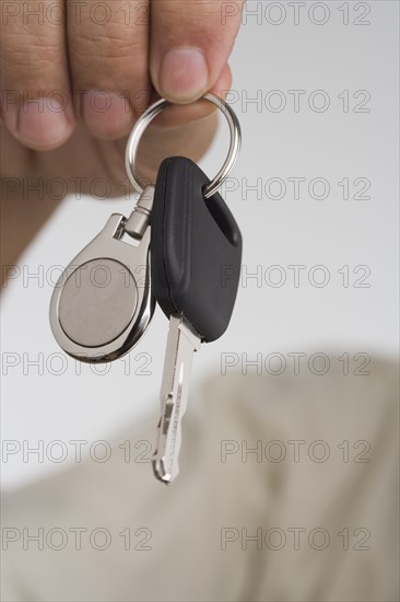 Close up of man's hand holding car key