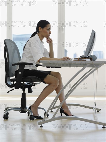 African businesswoman working at desk