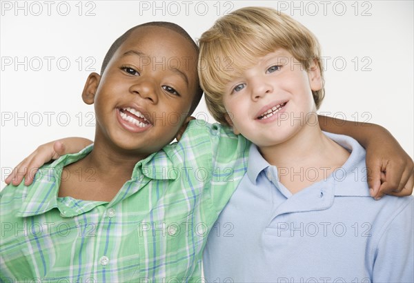 Portrait of two young boys hugging