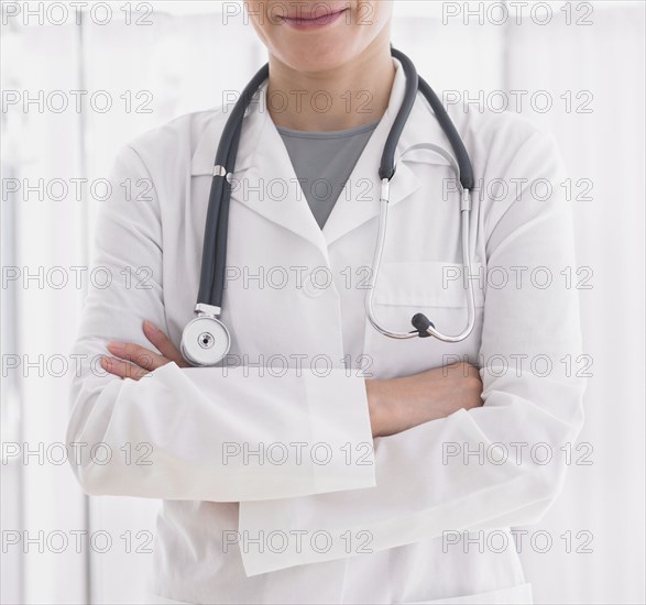 Close up of female doctor with arms crossed