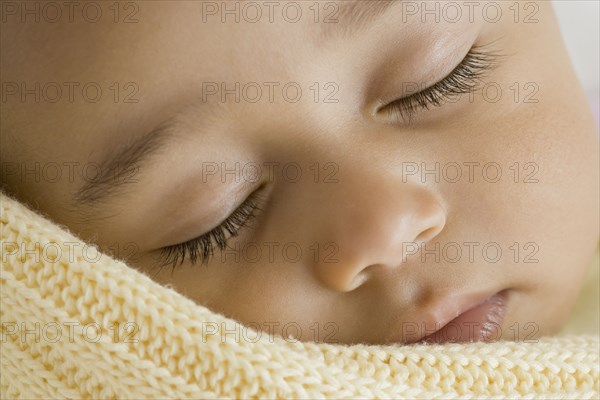 Close up of Hispanic baby sleeping