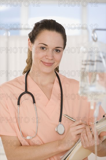 Hispanic female doctor holding chart