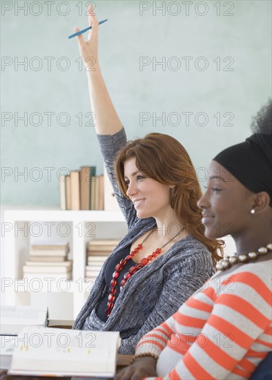 Two female college students in class