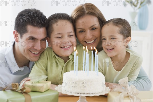 Hispanic boy celebrating birthday with family