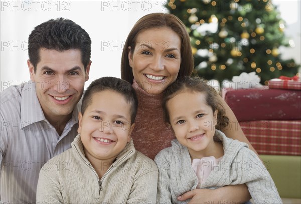 Portrait of Hispanic family on Christmas