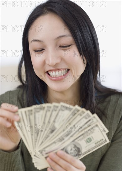 Asian woman counting money