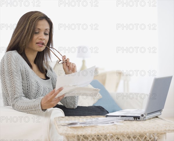 Indian woman paying bills