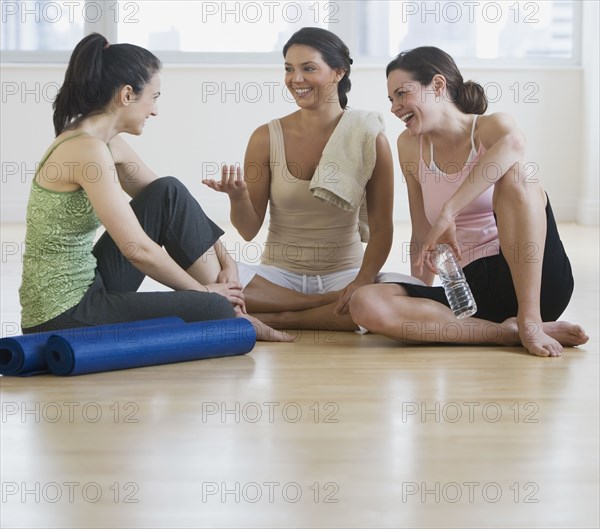 Three young women in yoga class