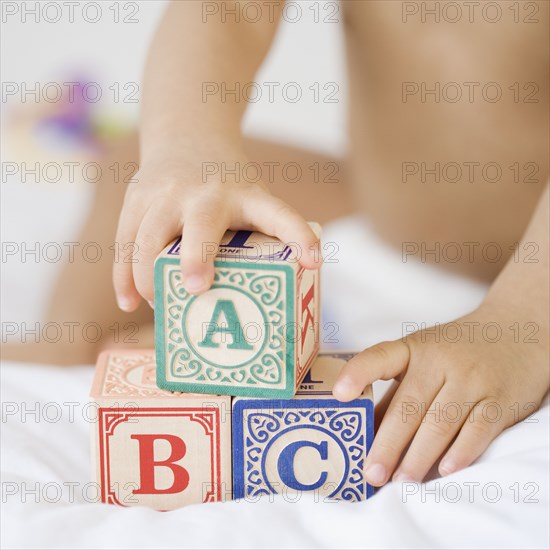 Hispanic baby playing with blocks