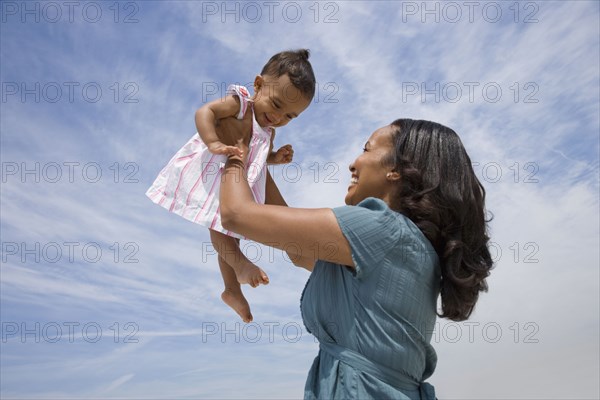 African American mother smiling at baby