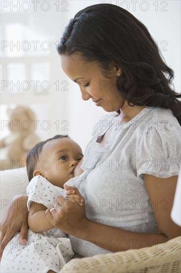 African American mother breastfeeding baby