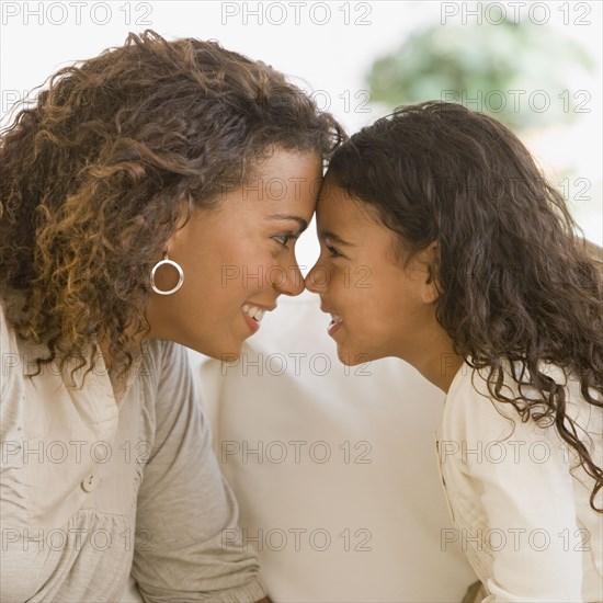 African mother and daughter touching noses