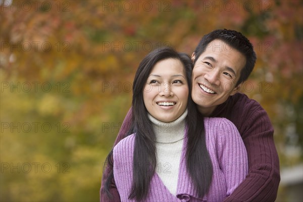 Asian couple hugging