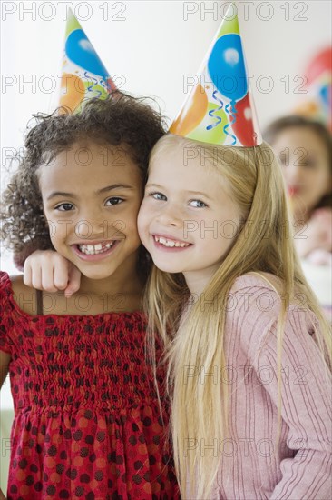 Multi-ethnic girls at birthday party