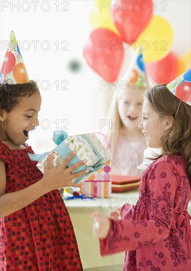 Multi-ethnic girls at birthday party