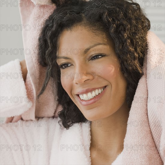 African woman drying hair