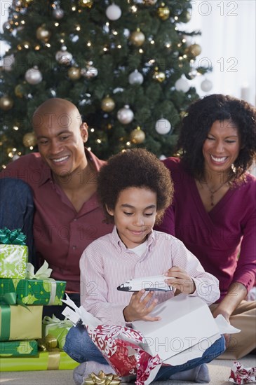 African family opening Christmas gifts