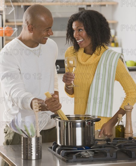 African couple making pasta