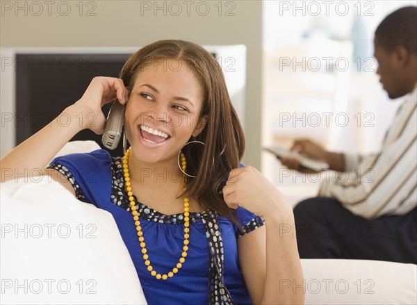 African woman talking on telephone