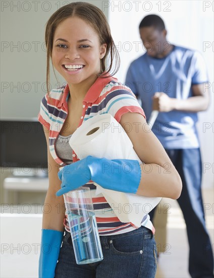 African woman holding paper towels