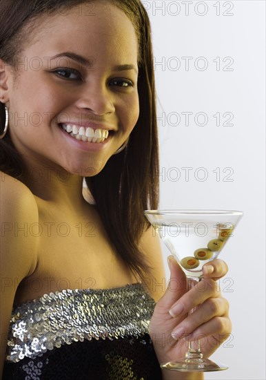 African woman drinking martini