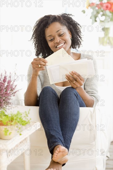 African woman reading mail