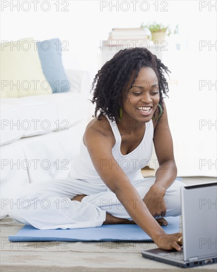 African woman looking at laptop