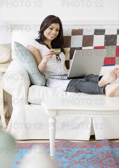 Mixed Race woman shopping online