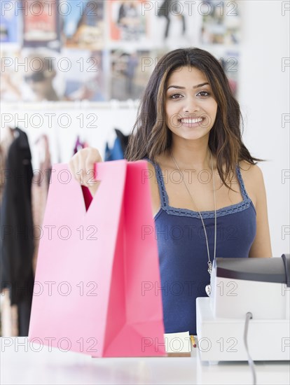 Middle Eastern sales clerk in shop