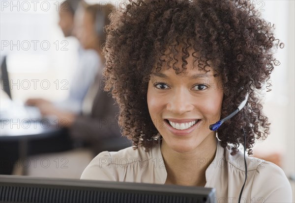 African woman wearing headset