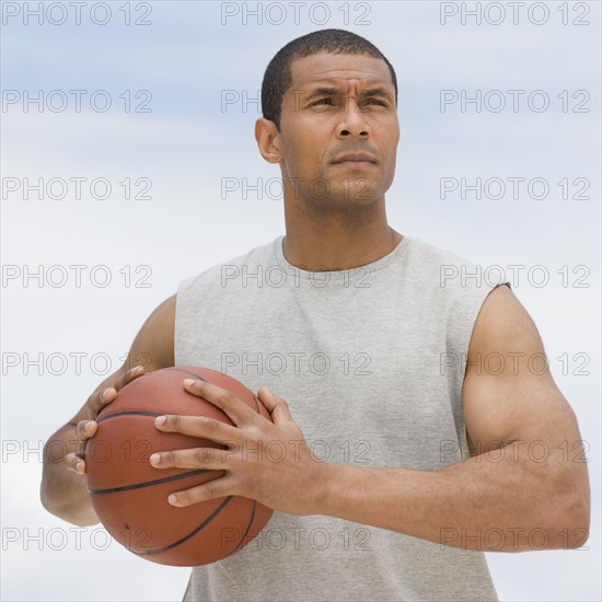 African man playing basketball