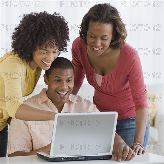 African business people working on laptop