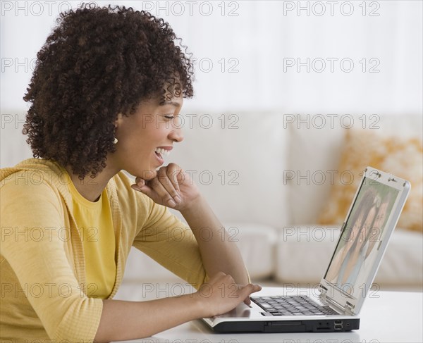 African woman looking at laptop