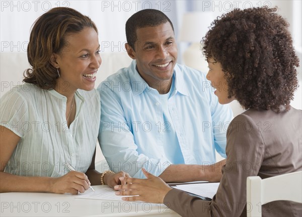 African couple receiving financial consultation