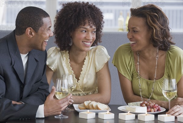 African man and women dining in restaurant