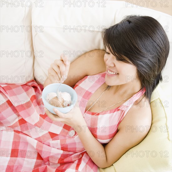 Asian woman eating ice cream